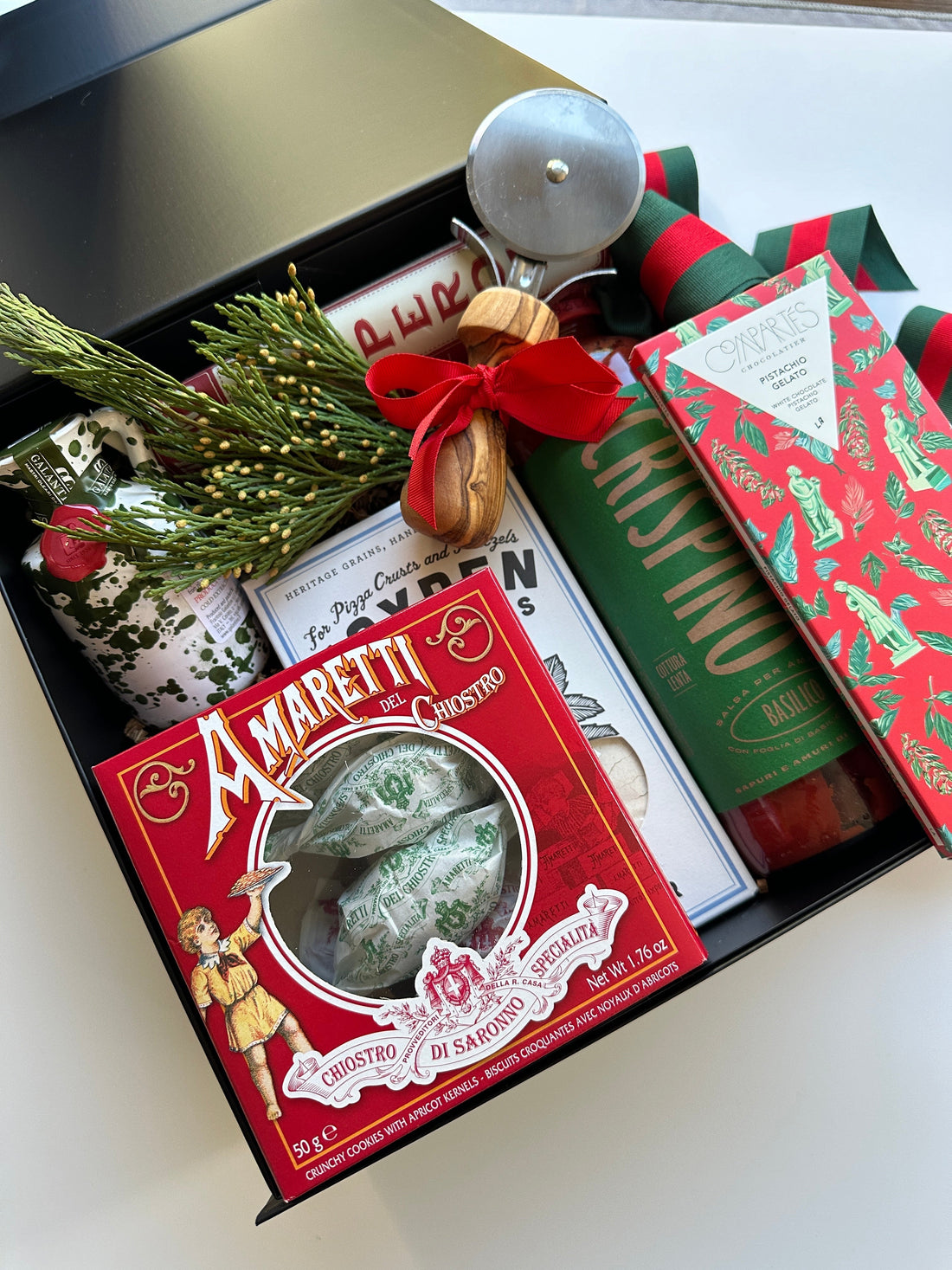 Curated corporate gift assortment featuring gourmet foods, entertaining items, and beautifully packaged gifts