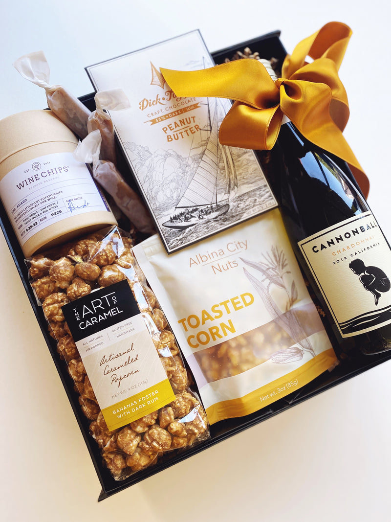 Gift Box with wine, popcorn and chocolate.