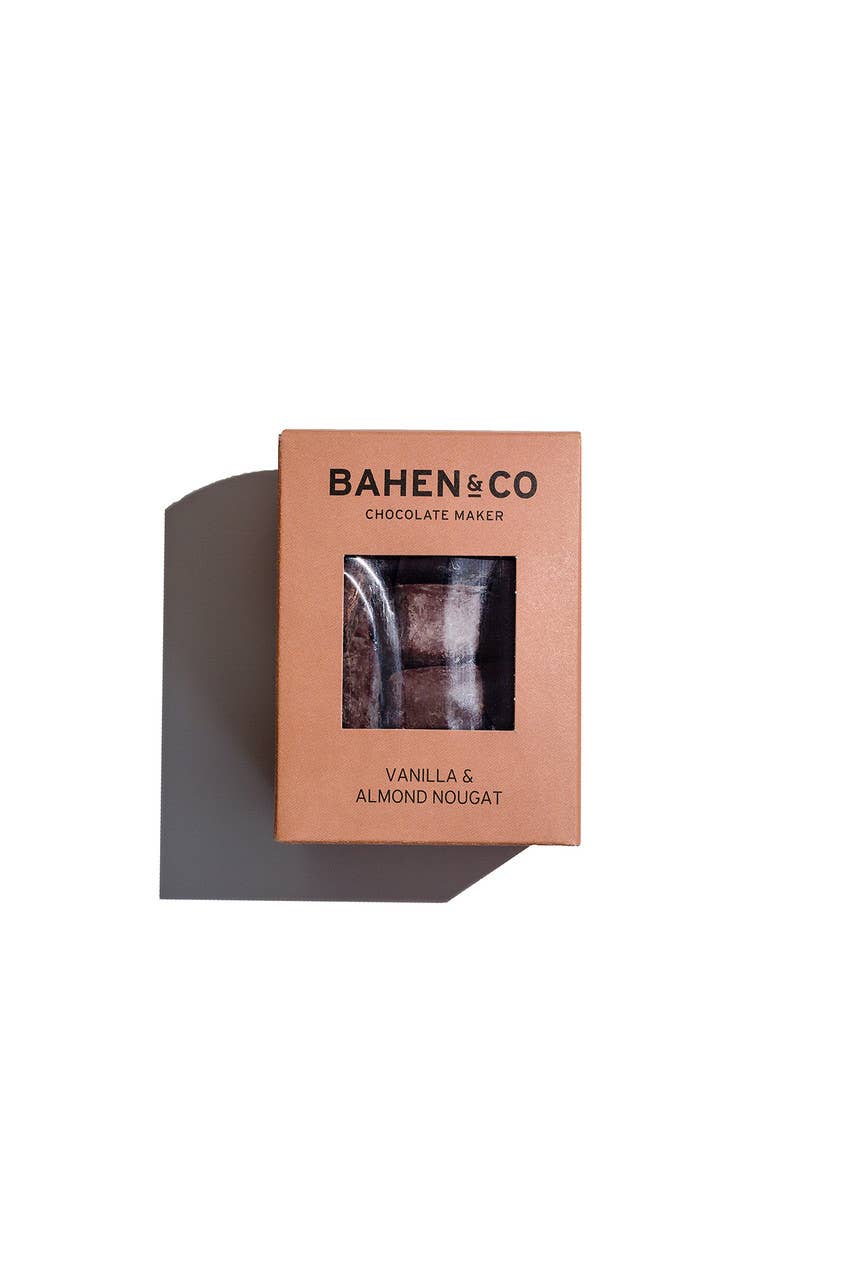 Bahen & Co vanilla and almond nougat chocolate bar with visible almonds and smooth chocolate coating on a white background.