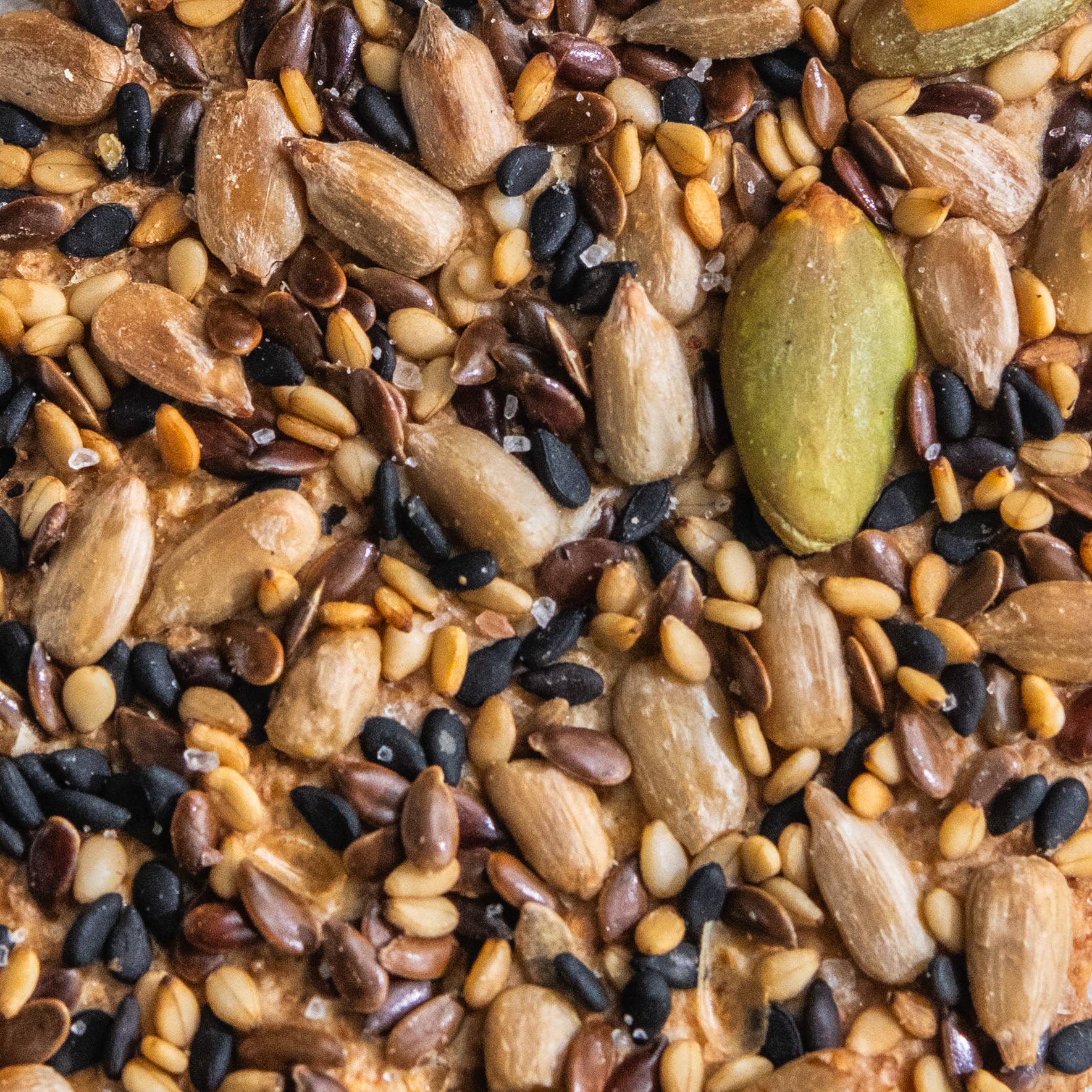 Seeded olive oil flatbreads snack by Potters Table, crispy flatbreads topped with seeds, perfect for sharing or snacking.