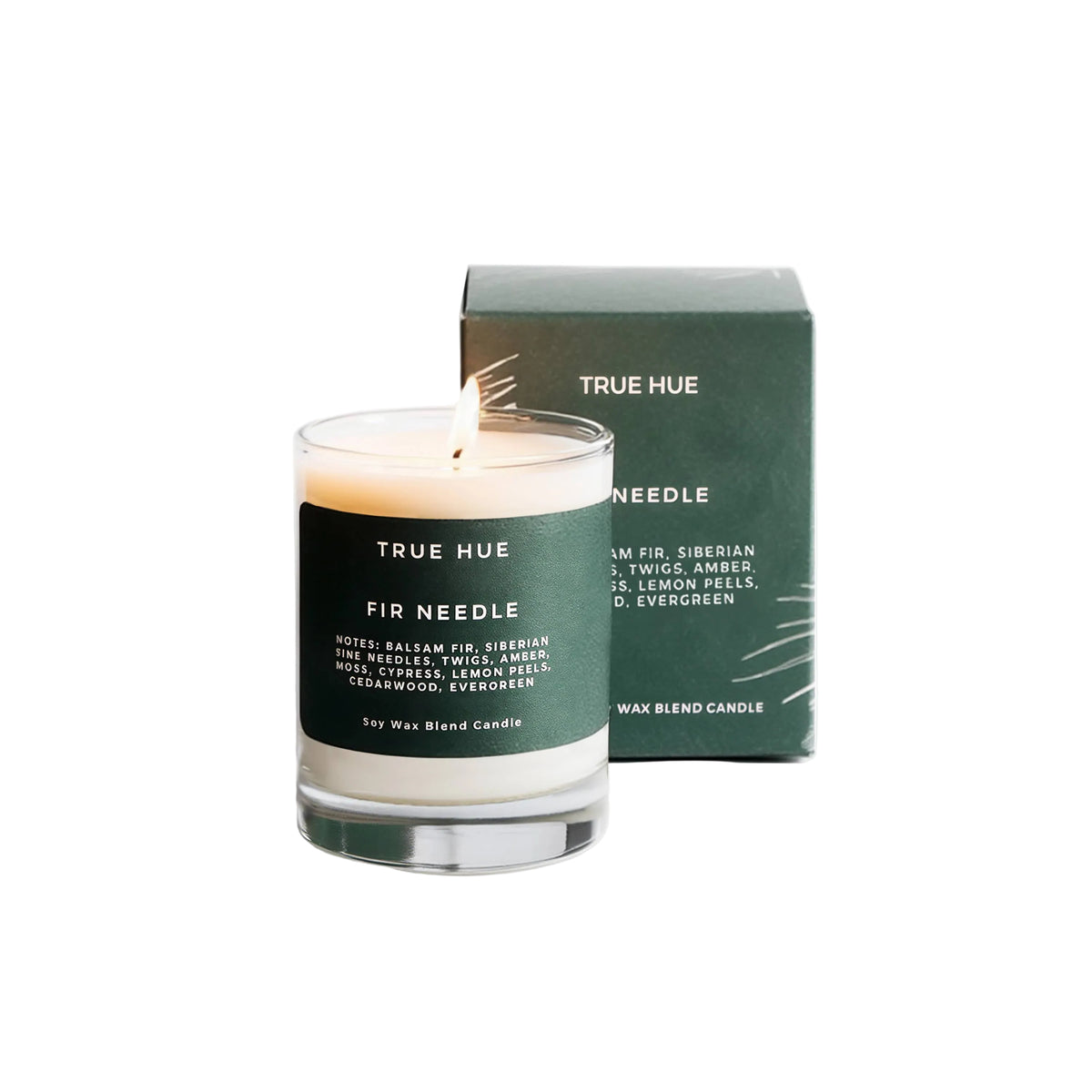 True Hue Fir Needle Mini Candle with realistic pine needle design, small size, and warm candle flame in a decorative container.