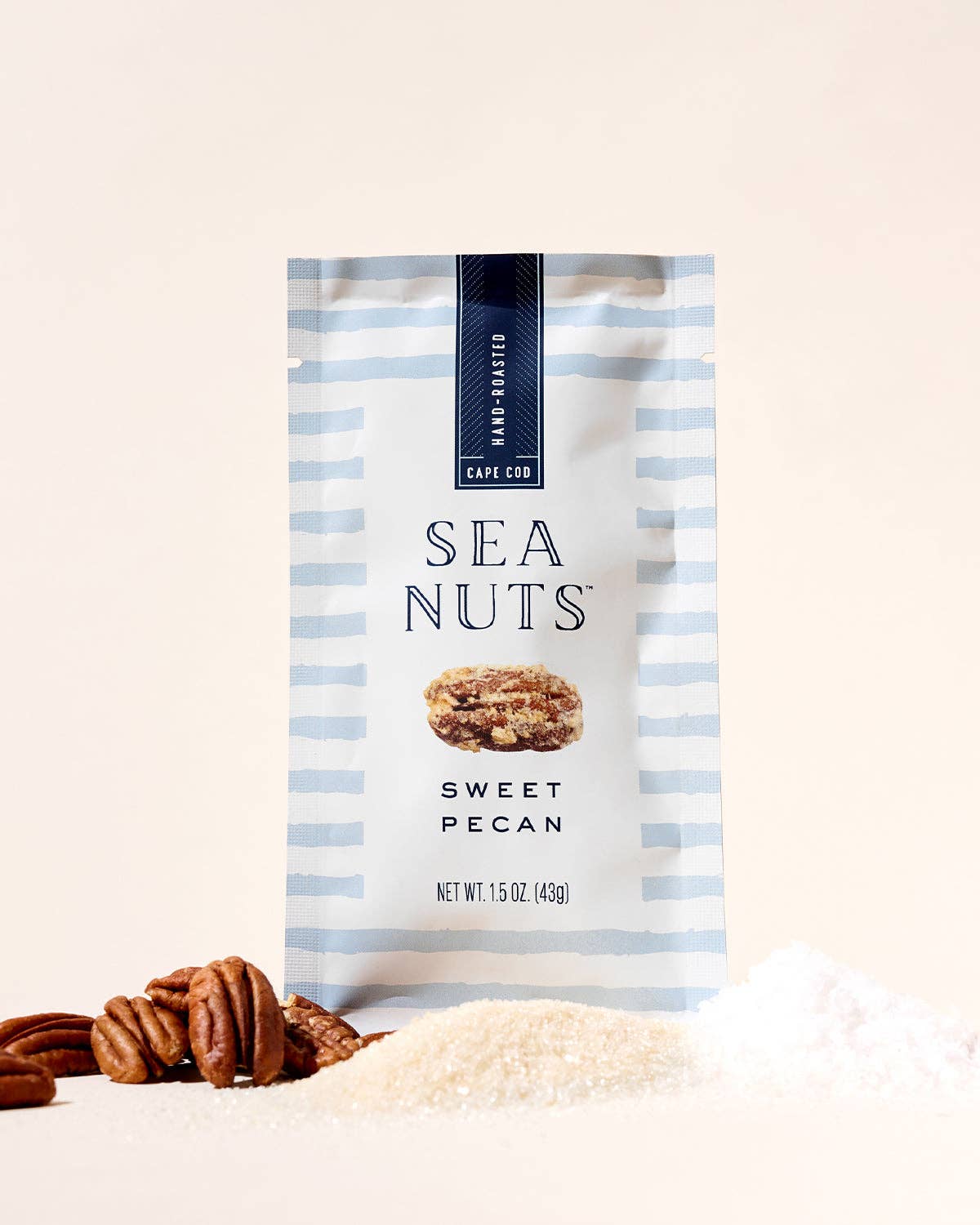 Sea Nuts Sweet Pecans in a bowl, showing crispy, caramelized pecan nuts from the Sea Nuts brand.