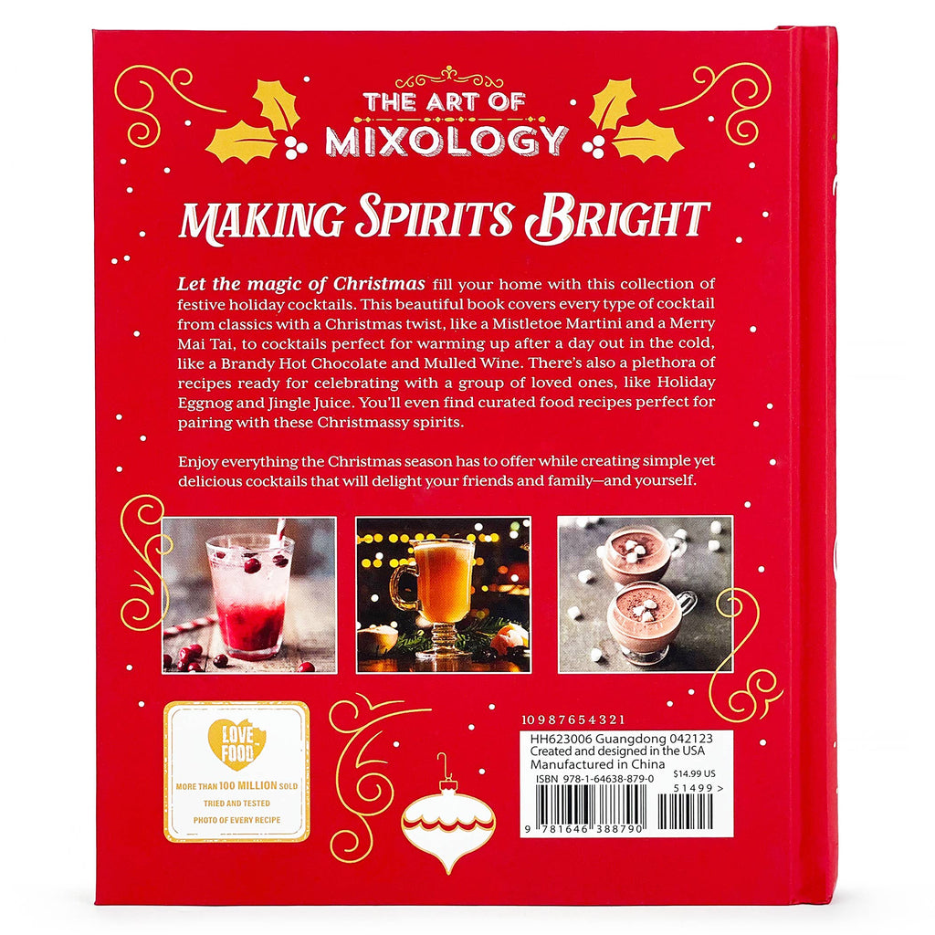Open book titled "Art of Mixology: Making Spirits Bright" Christmas cocktails guide by Cottage Door Press on a wooden table.