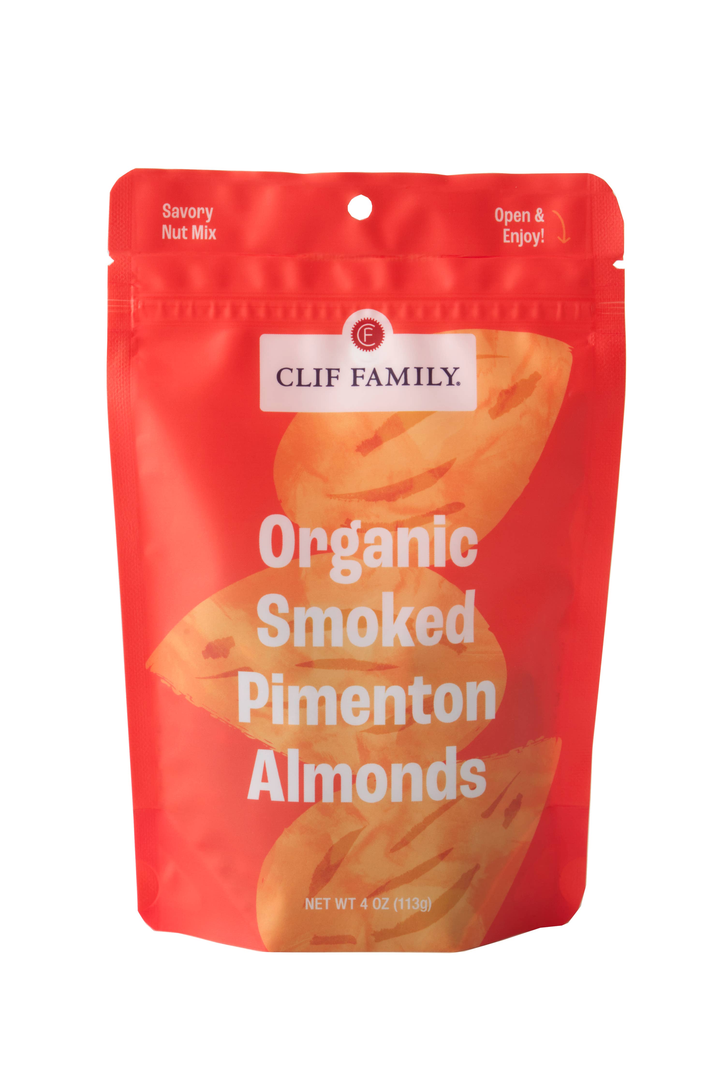 Clif Family Napa Valley smoked pimentón almonds, roasted nuts with smoky paprika flavor, in a clear bowl on a rustic wooden surface.