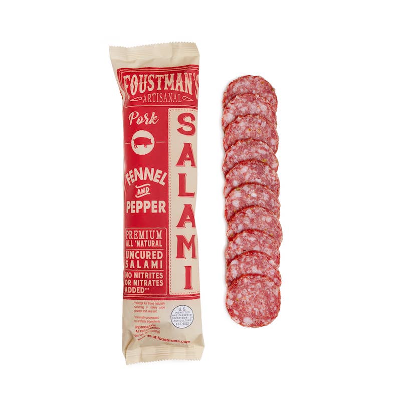 Foustian's Artisana salami packaging with sliced salami on a white background