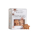 A box of Rustic Bakery Twinkies star-shaped cinnamon sponge cakes sits on a light gray surface against a neutral gray background, with two star-shaped cakes placed in front of the box.