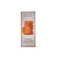 Rustic Bakery salted caramel shortbread cookies with a golden-brown crust and caramel filling, on a rustic plate.