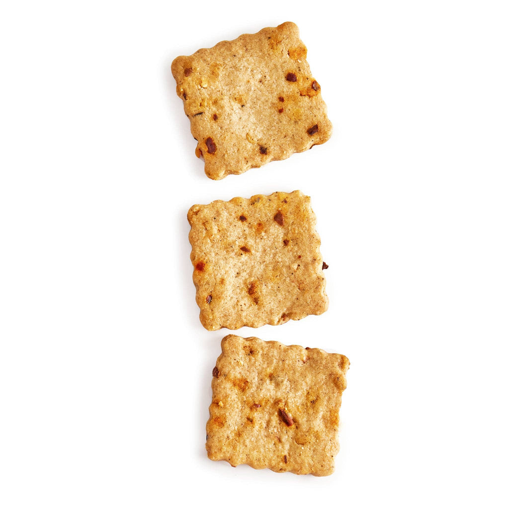 Rustic Bakery Chipotle and Cayenne Crackers on a wooden surface, showing the spicy, flavorful crackers with a rustic texture.