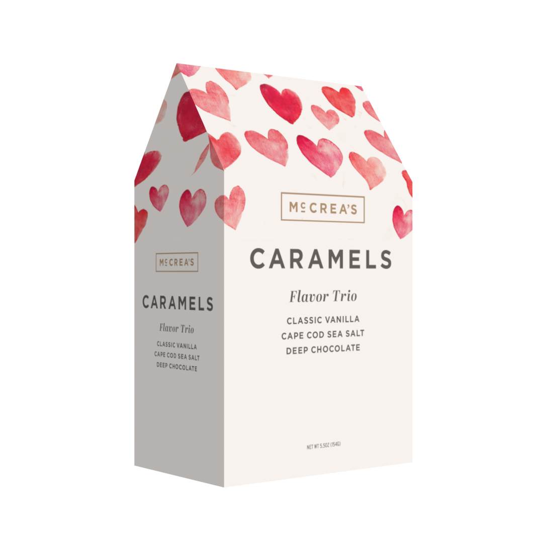 McCrea's Candies Hugs & Kisses chocolate and candy gable box with trio flavors, featuring colorful packaging and assorted confections.