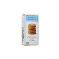 Rustic Bakery chocolate chip cookies stacked on a plate, showing golden-brown edges and chocolate chunks inside.