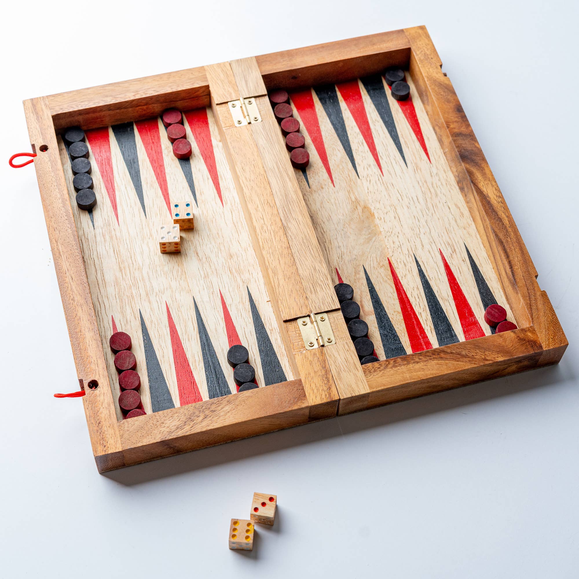 Verve Culture backgammon game set with mango wood board, featuring game pieces and dice for traditional gameplay.