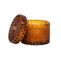 Brown textured crystal  glass candle with lid on a white background