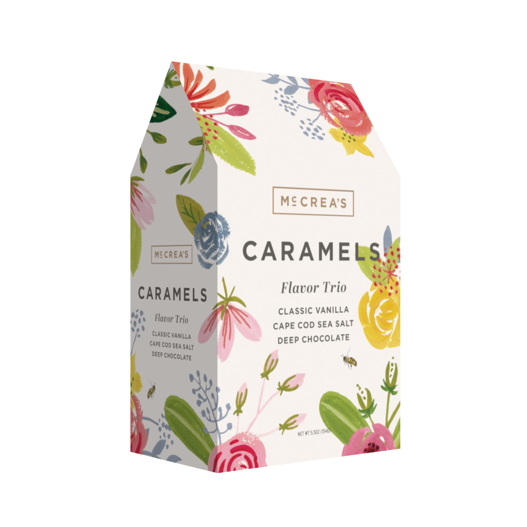 McCrea's Candies Bouquet Gable Box with trio of assorted chocolate and candy flavors, colorful packaging and decorative ribbon.