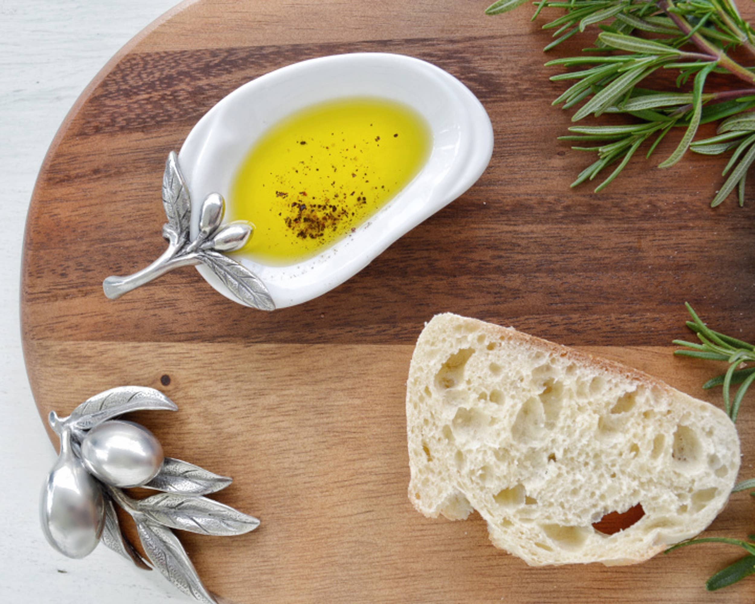 Vagabond House olive oil server with spoon rest, featuring a decorative metal design perfect for kitchen or dining use