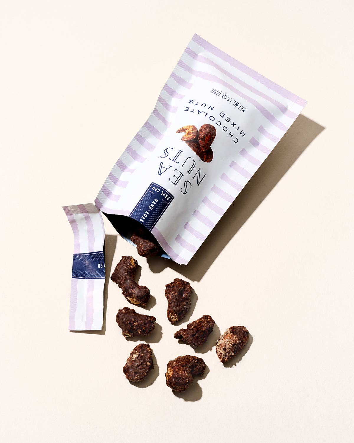 Sea Nuts chocolate mixed nuts in a bowl, showcasing a variety of coated nuts with rich chocolate flavor, natural and crunchy appearance.
