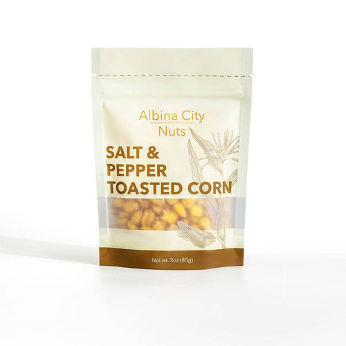 Albina City Nuts Salt & Pepper Toasted Corn snack bowl showing crunchy, salted, and peppery toasted corn snacks.