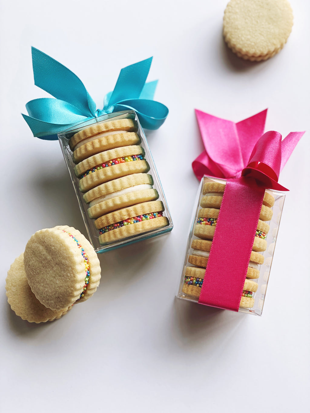 Poppins & Post buttercream sandwich cookies displayed in four boxes, showcasing creamy filling and crisp cookie shells.