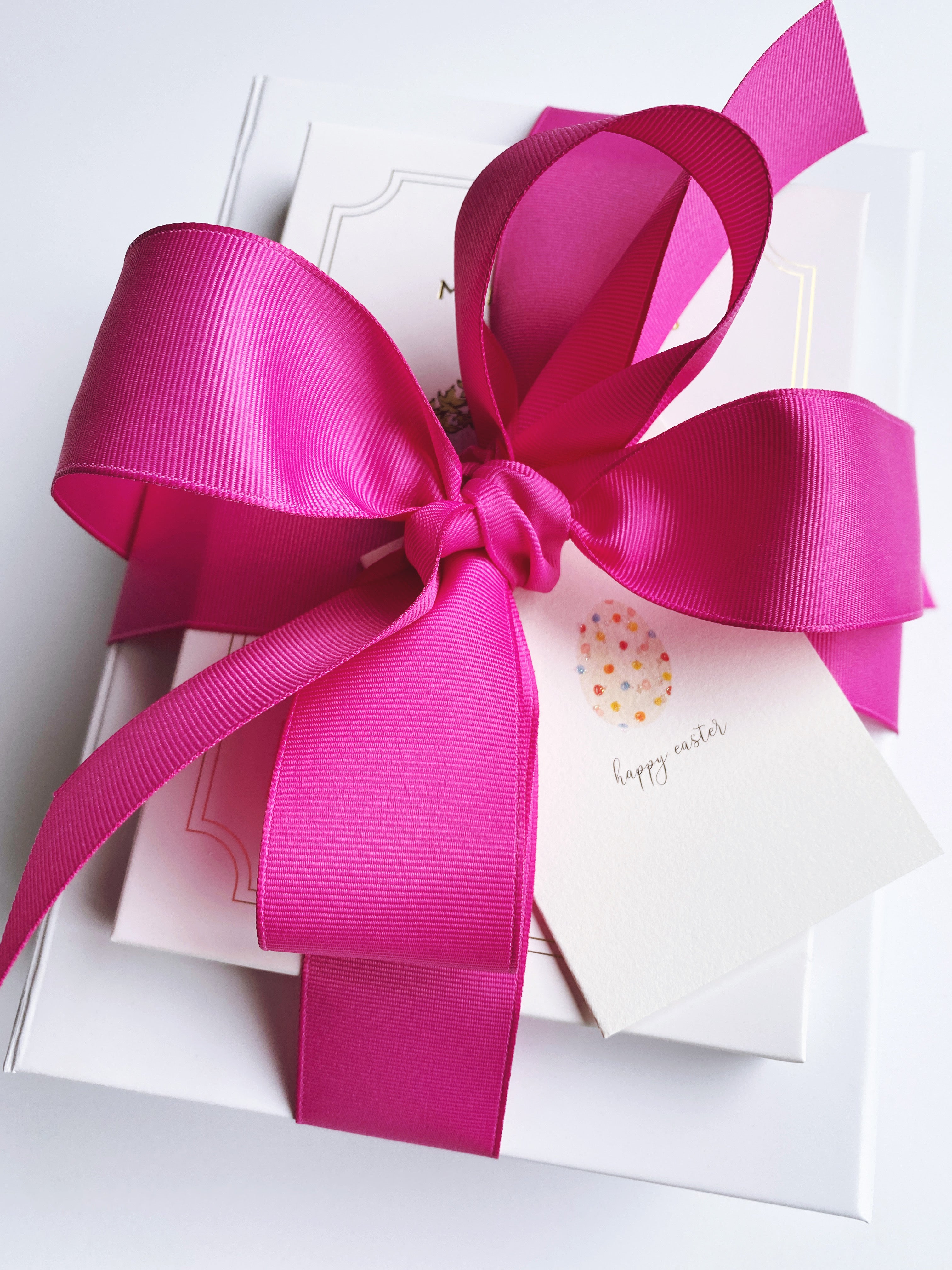 Poppins & Post gift box with a festive card, arranged with tissue paper and wrapping for a thoughtful gift presentation.