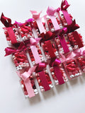 Set of 10 Poppins & Post chocolate and candy Valentine's Day treats, featuring colorful wrapped chocolates and festive designs.