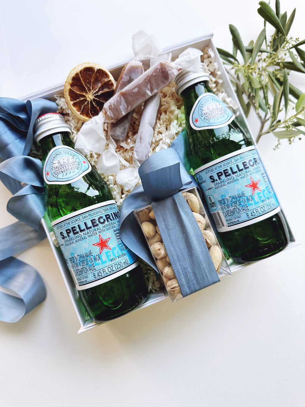 Set of 12 wedding arrival welcome gifts from Poppins & Post, featuring elegant, personalized keepsakes for guests.