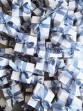 Gift box and card from Poppins & Post gift service, featuring a neatly wrapped package with a personalized greeting card.