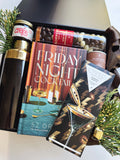 Poppins & Post gift box featuring colorful holiday-themed spirits and festive decorations for celebrating the season