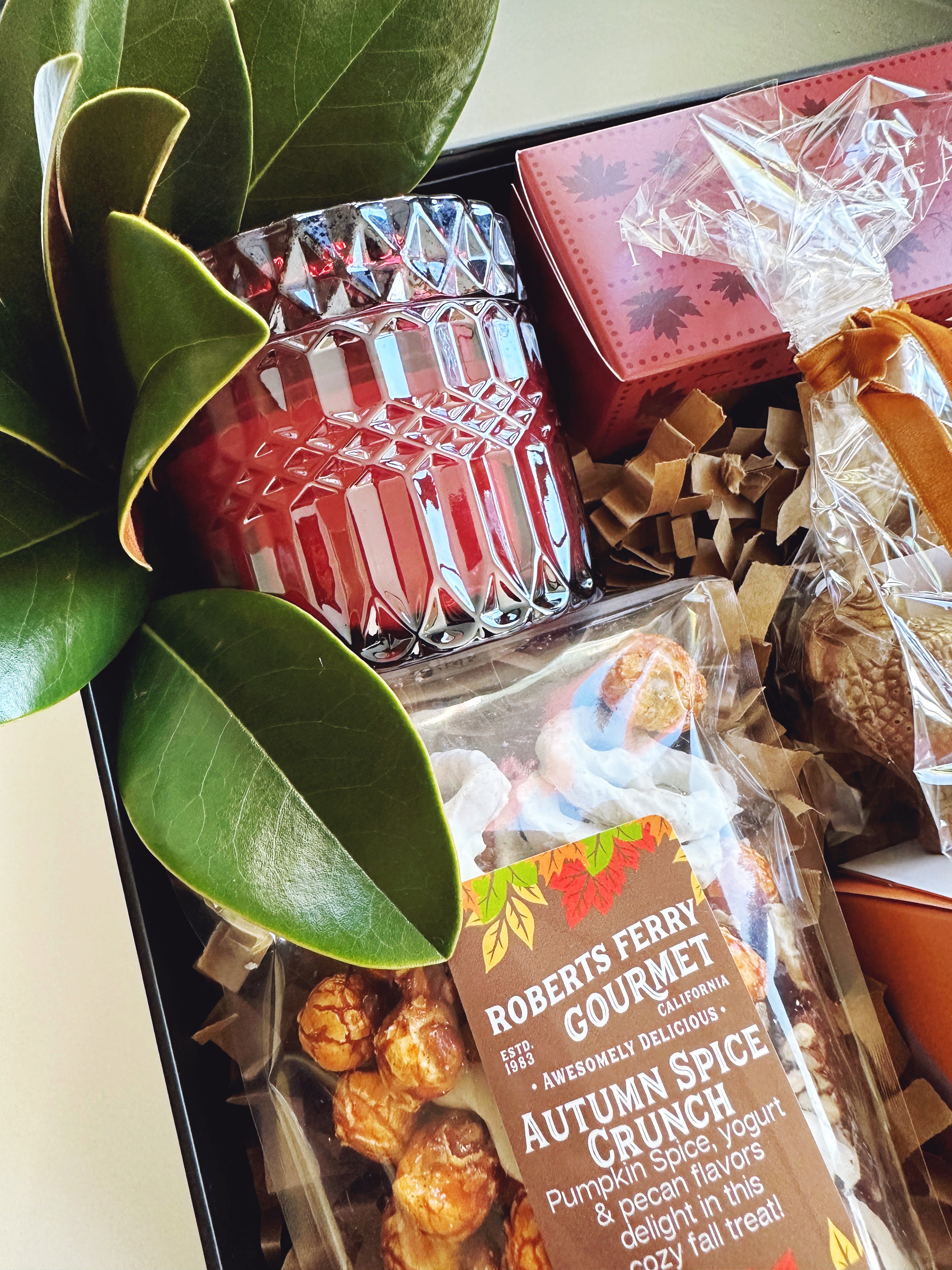 Fall Hostess gift box from Poppins & Post with seasonal wrapping and decorative autumn accents.