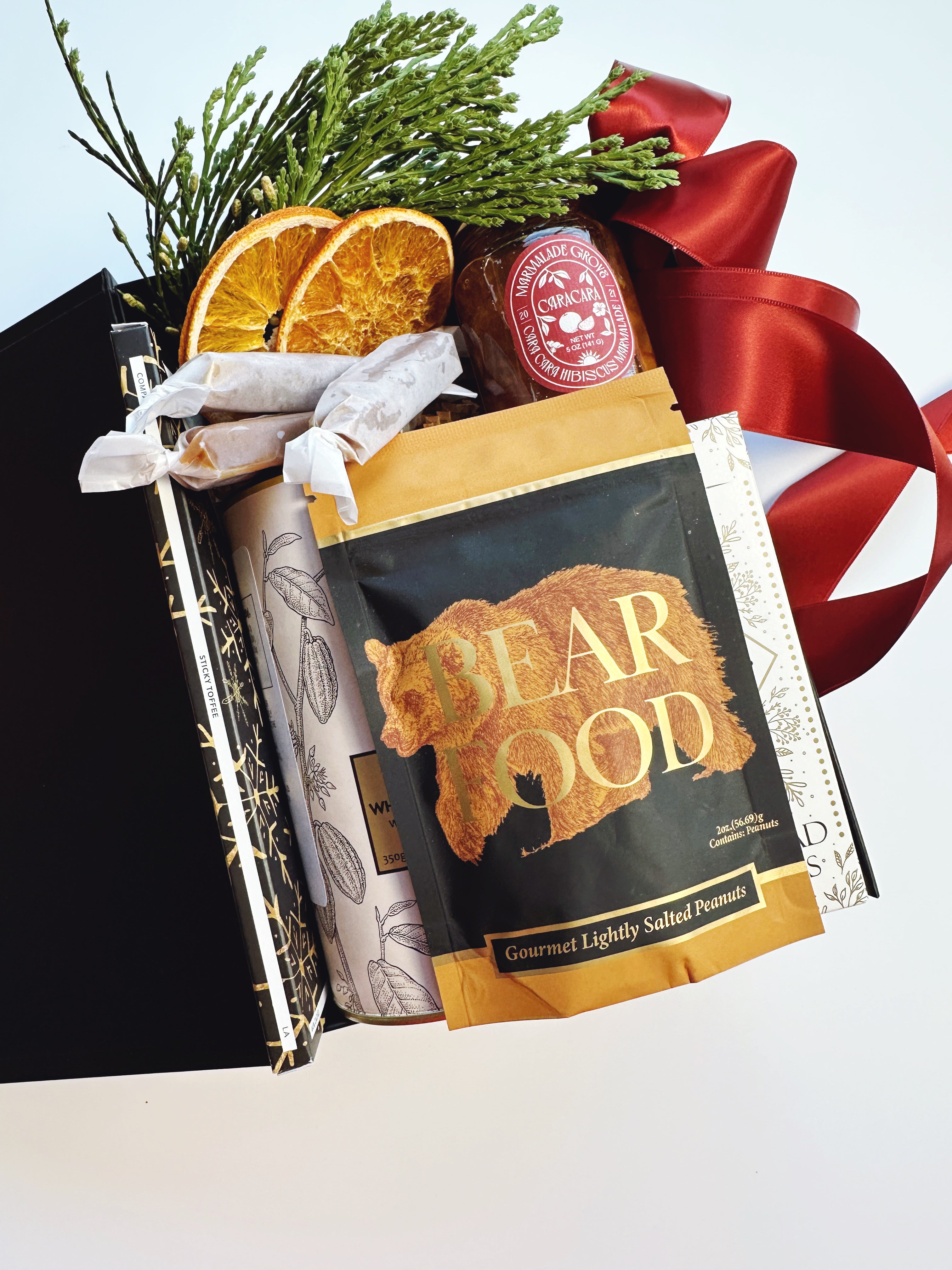 Mini Treat Box gift box by Poppins & Post with colorful paper wrapping and ribbon, perfect for gifting or special occasions.