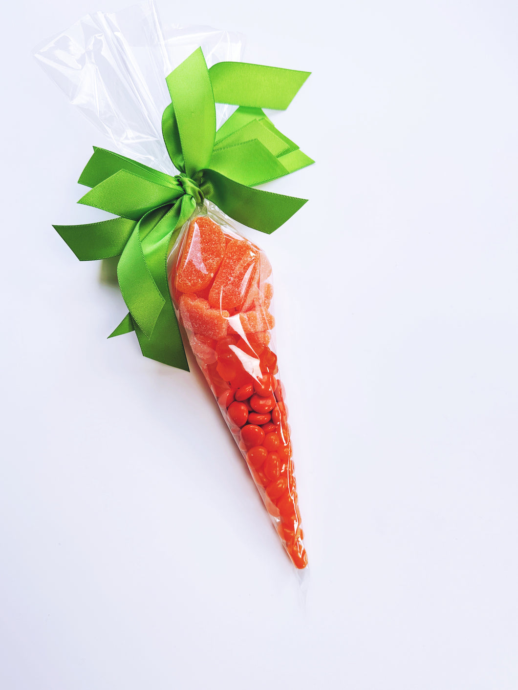 Colorful Poppins & Post Easter Candy Carrots in bright orange and green, shaped like carrots, perfect for holiday treats.