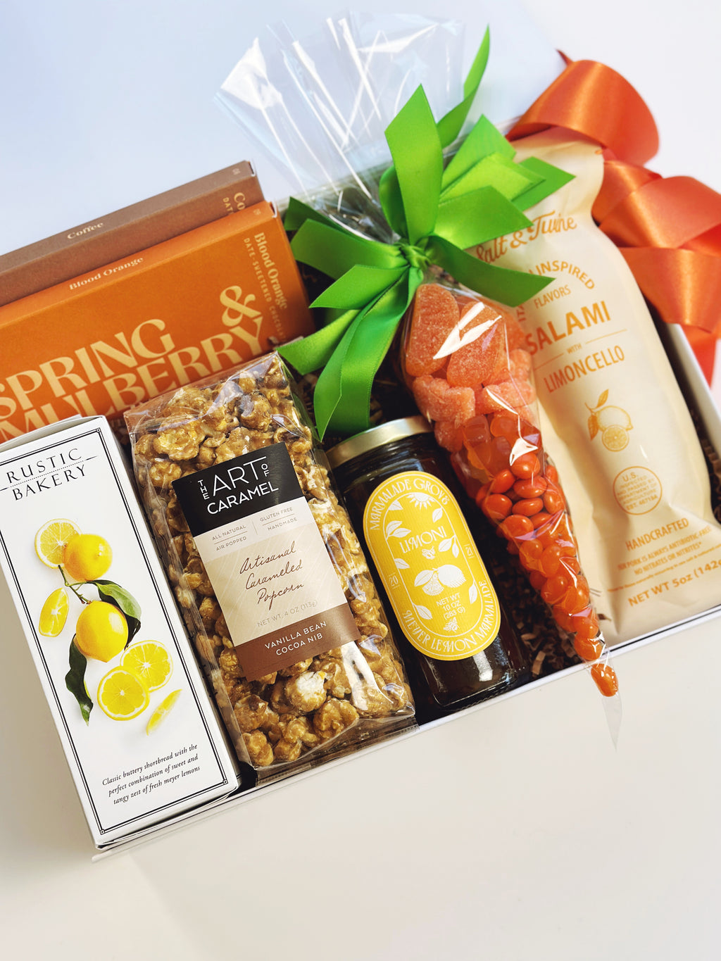 Spring Citrus gift box from Poppins & Post with colorful citrus-themed packaging and assorted citrus treats inside.