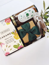 Colorful bouquet of fresh flowers in a curated gift box by Poppins & Post, beautifully arranged with vibrant blooms.