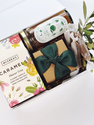 Colorful bouquet of fresh flowers in a curated gift box by Poppins & Post, beautifully arranged with vibrant blooms.