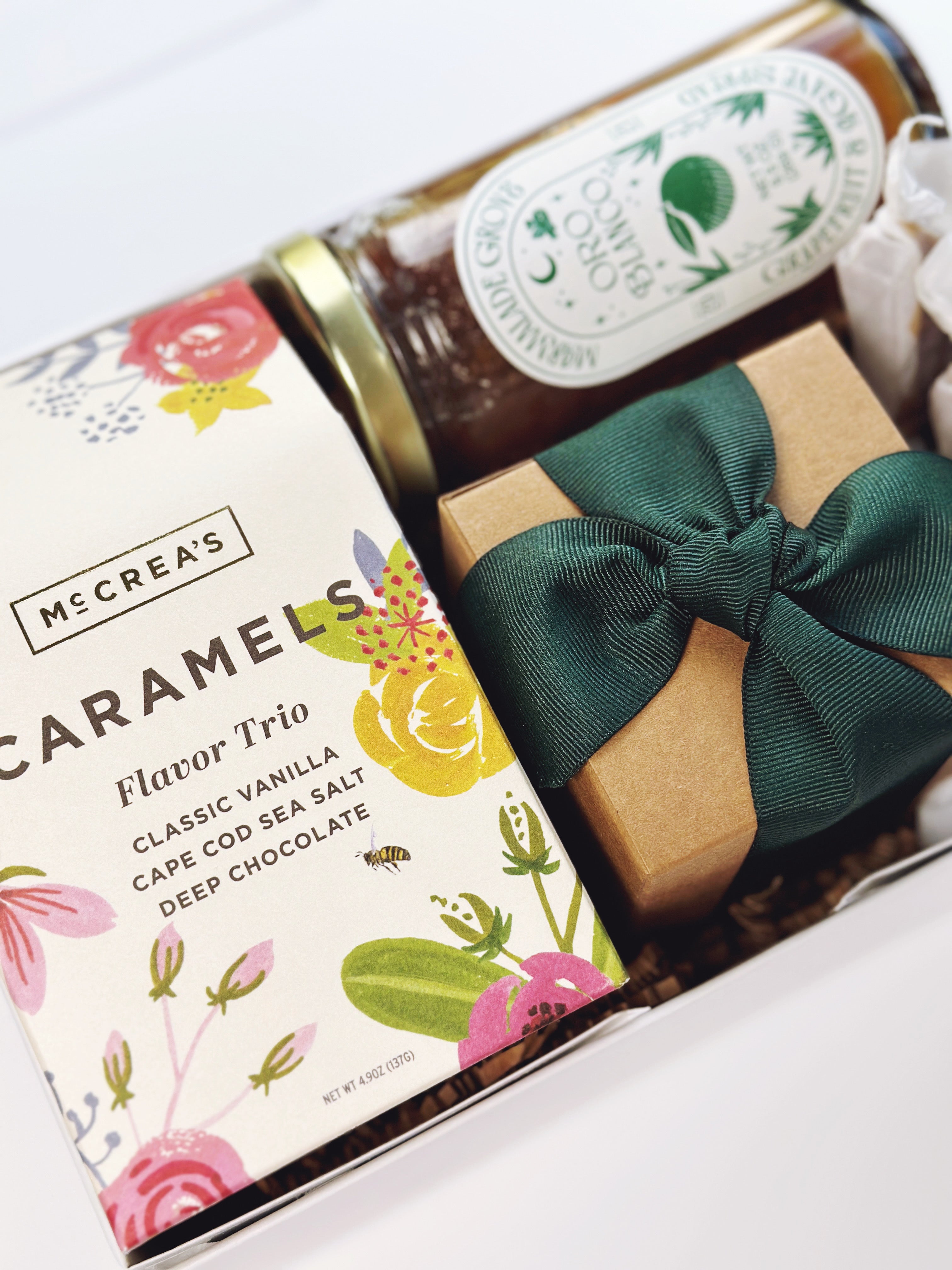 Colorful flowers in bloom gift box by Poppins & Post, showcasing vibrant floral arrangements and packaging.