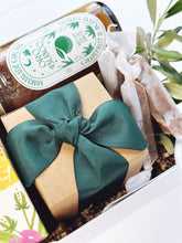 Beautiful arrangement of fresh flowers in bloom, curated gift by Poppins & Post with vibrant colorful blossoms in a stylish display.