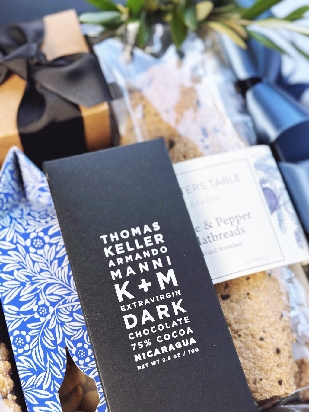 Gift box from Poppins & Post named The Pacific, featuring neatly arranged items with colorful wrapping and decorative elements.