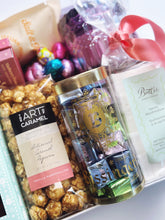 Deluxe Easter Box curated gift from Poppins & Post with festive treats and spring-themed decorations.