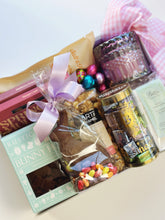 Deluxe Easter Box by Poppins & Post, a curated gift with colorful Easter-themed items and festive packaging.