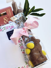 Spring Fling gift box by Poppins & Post featuring colorful floral packaging and assorted sweet treats inside.