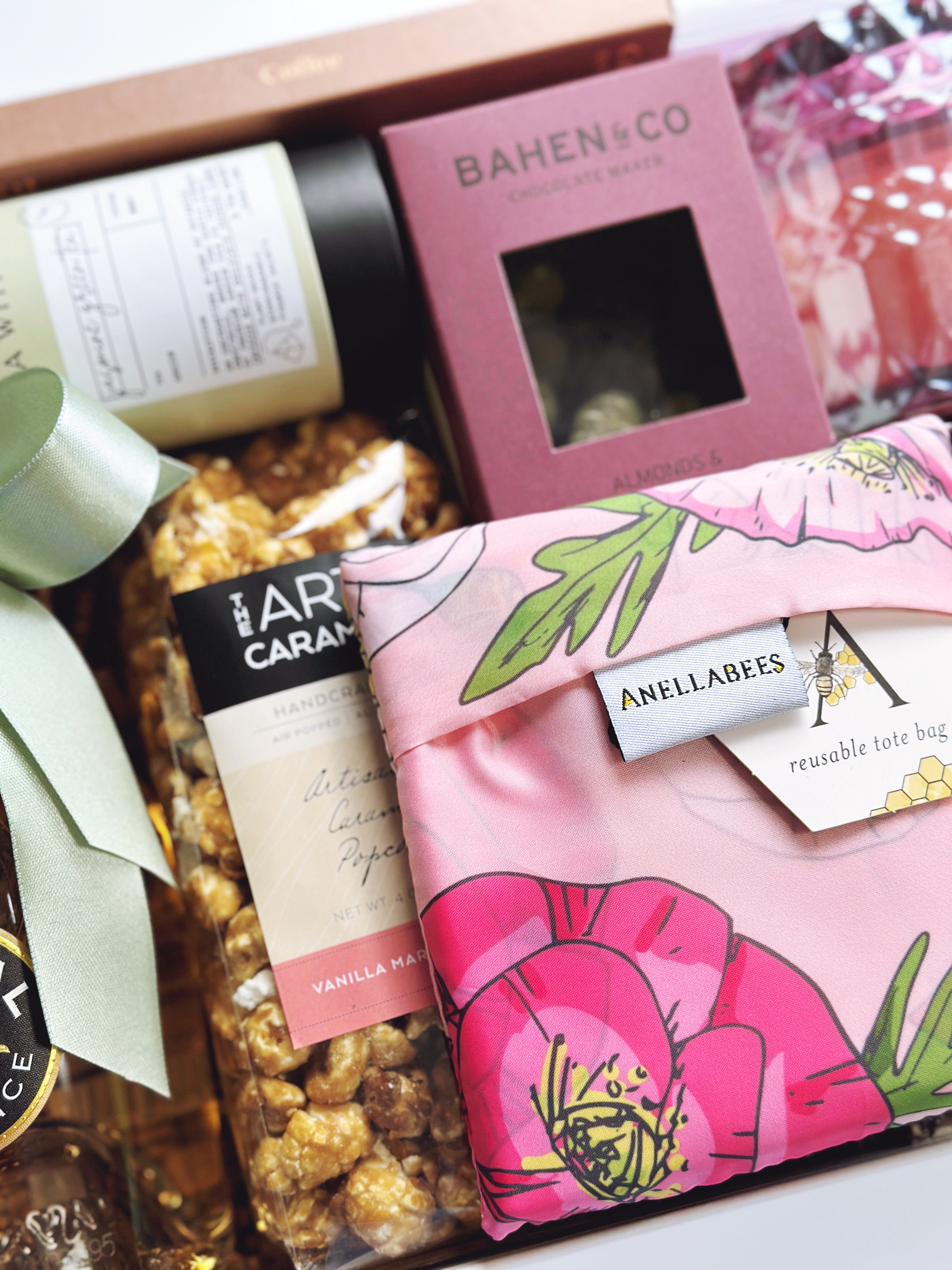In Full Bloom gift box by Poppins & Post featuring colorful floral-themed packaging and assorted gift items.