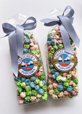 Thatcher's Gourmet Popcorn Spring Mix Popcorn in an 8oz bag, featuring colorful, mixed popcorn kernels with a spring-themed design.