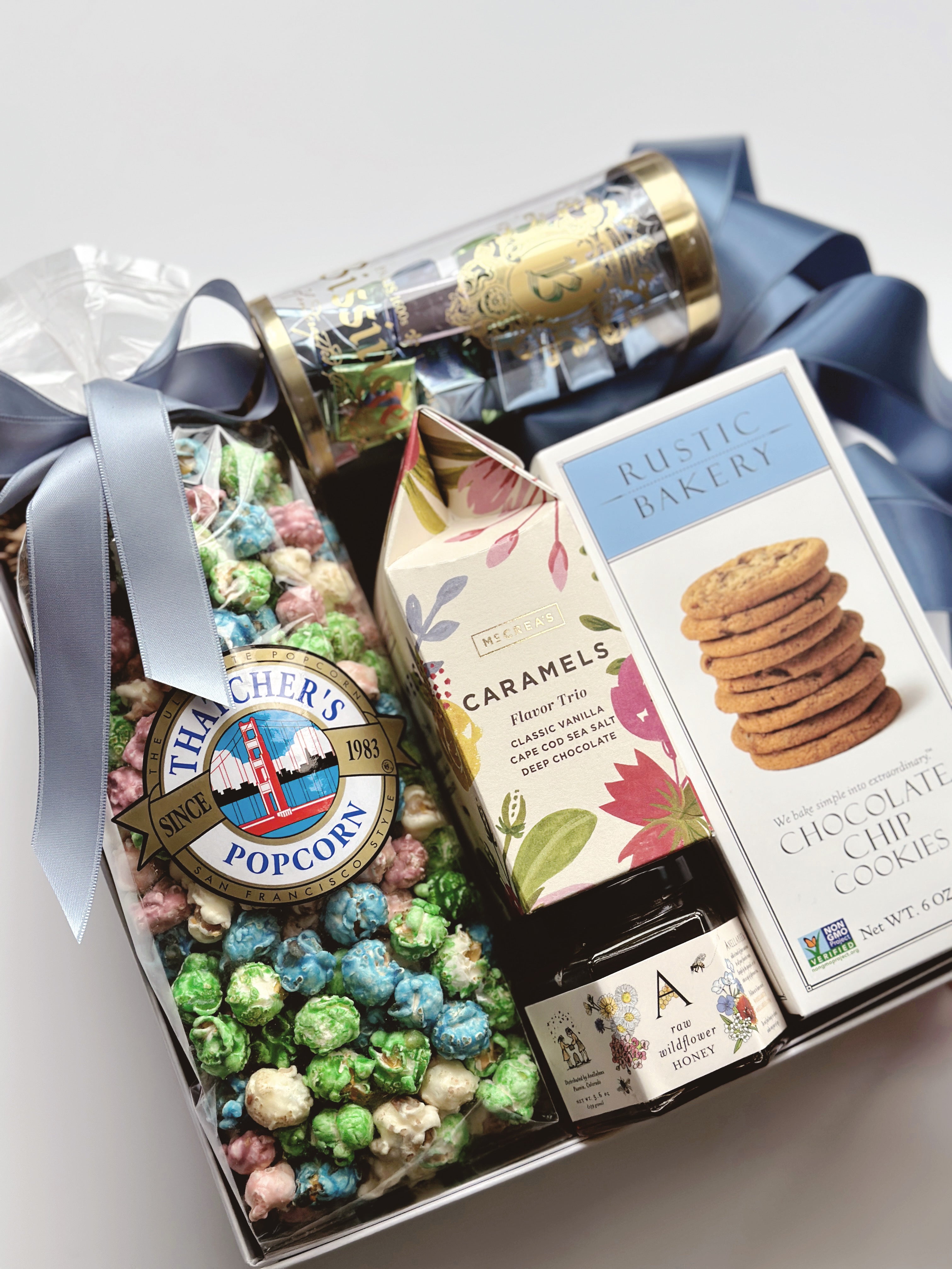 Poppins & Post The Artisan Spring Gift Box with colorful packaging and curated artisan treats inside.