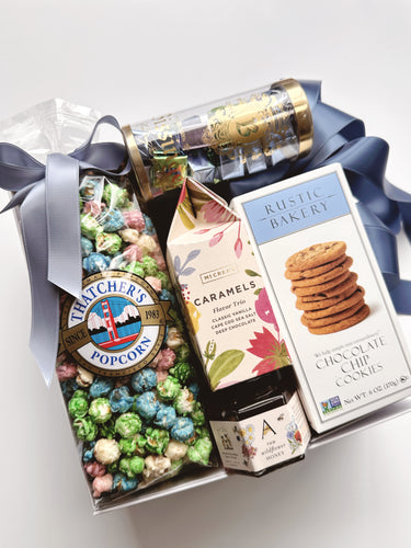 Curated gift box from Poppins & Post featuring artisan spring-themed items and decorative packaging.