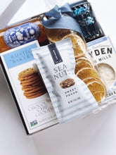 Poppins & Post Snacks by the Sea gift box with assorted savory and sweet snacks, beautifully arranged for gifting.