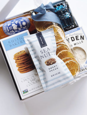Poppins & Post Snacks by the Sea gift box with assorted savory and sweet snacks, beautifully arranged for gifting.