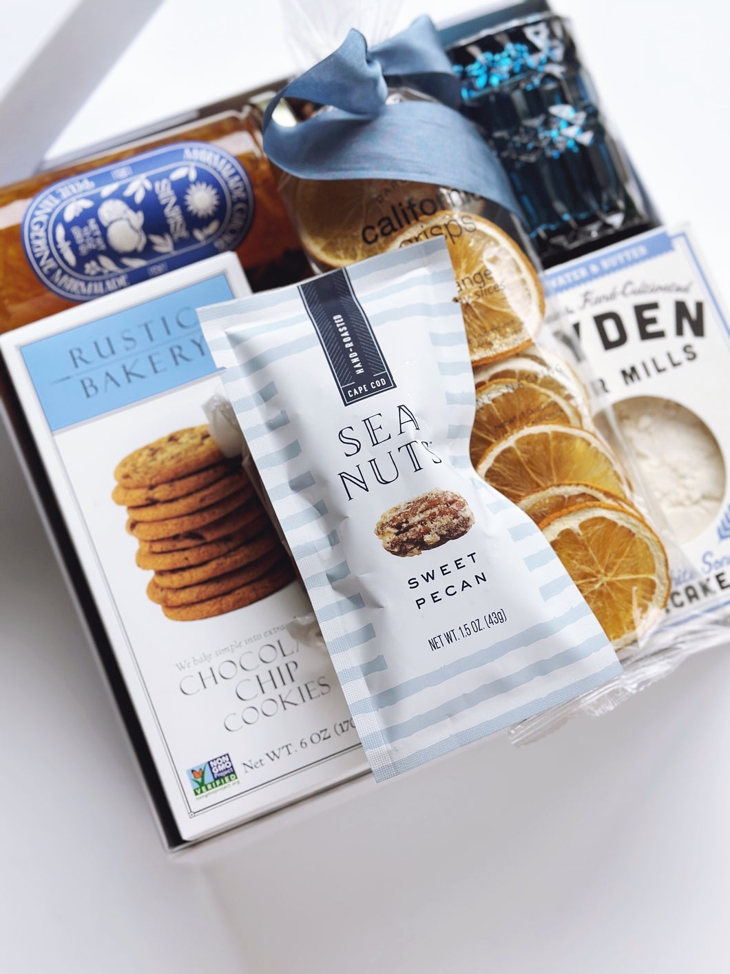 Poppins & Post Snacks by the Sea gift box with assorted savory and sweet snacks, beautifully arranged for gifting.