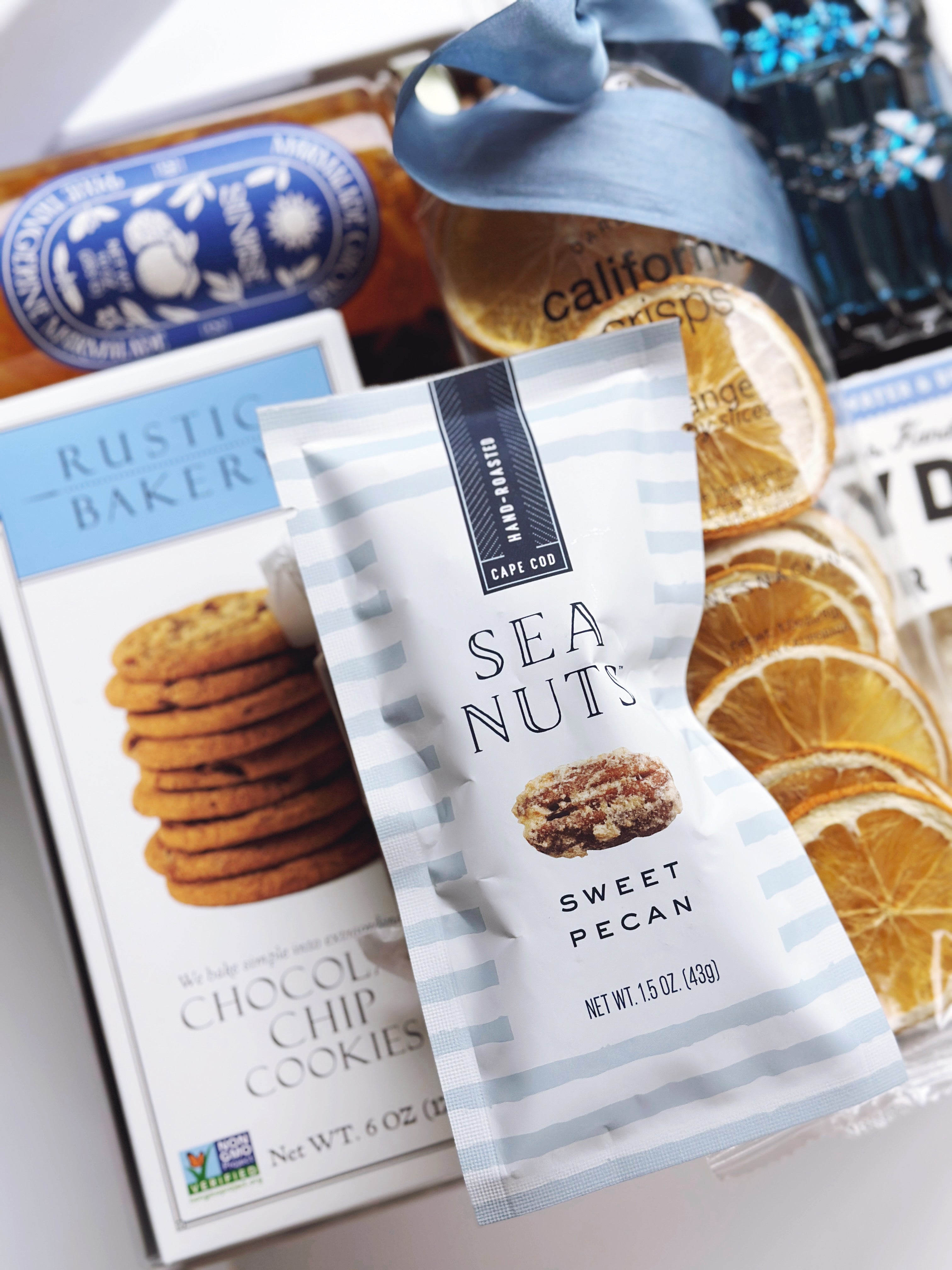 Assorted snack gift box from Poppins & Post featuring an elegant arrangement of seaside-inspired treats and packaging.