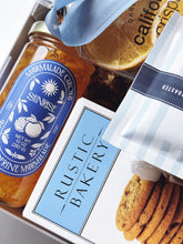 Gift box of Snacks by the Sea from Poppins & Post, featuring assorted seaside-themed snacks in a decorative box.