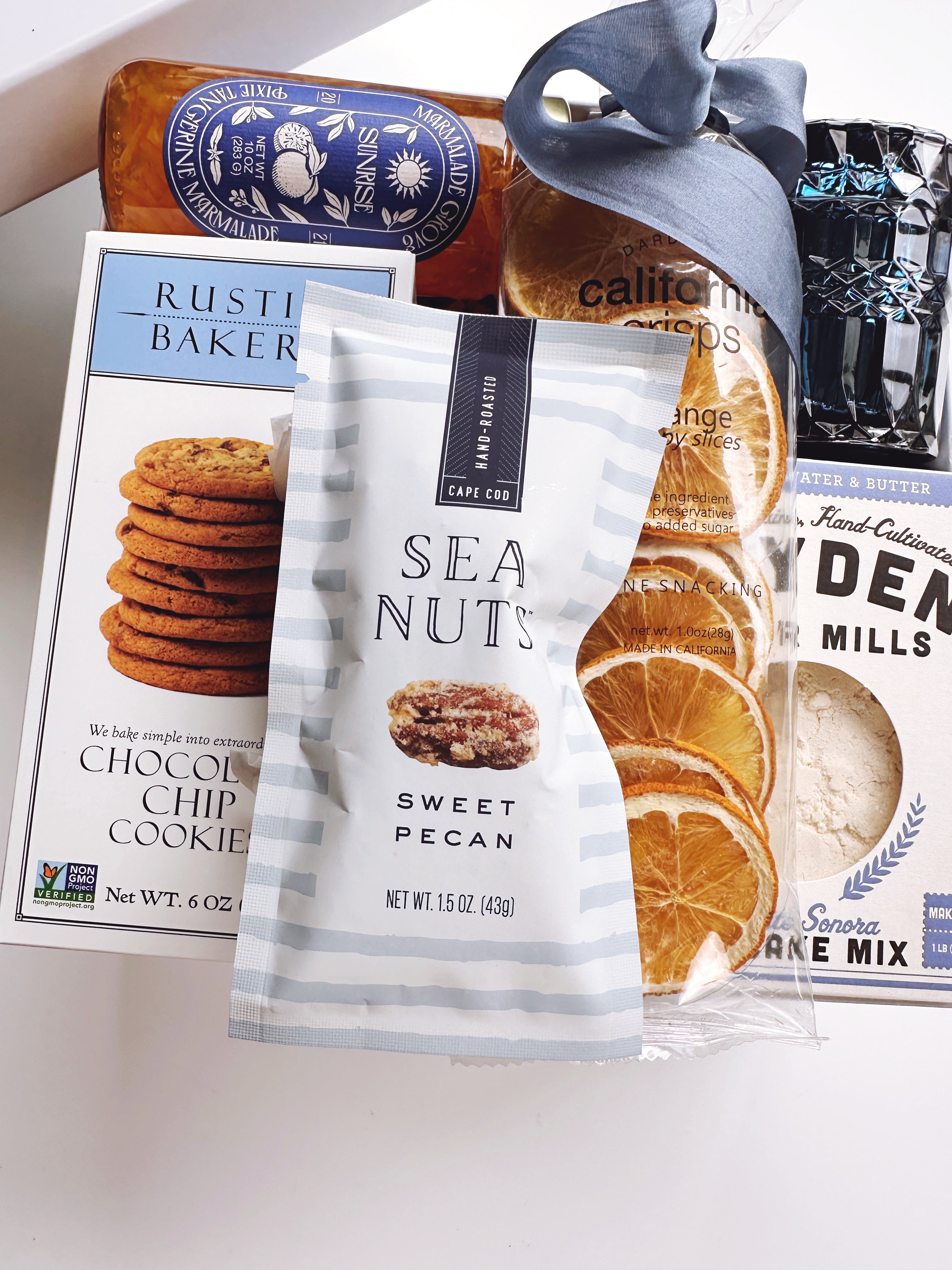 Gift box of assorted snacks by the sea from Poppins & Post, featuring a variety of seaside-inspired treats and packaging.