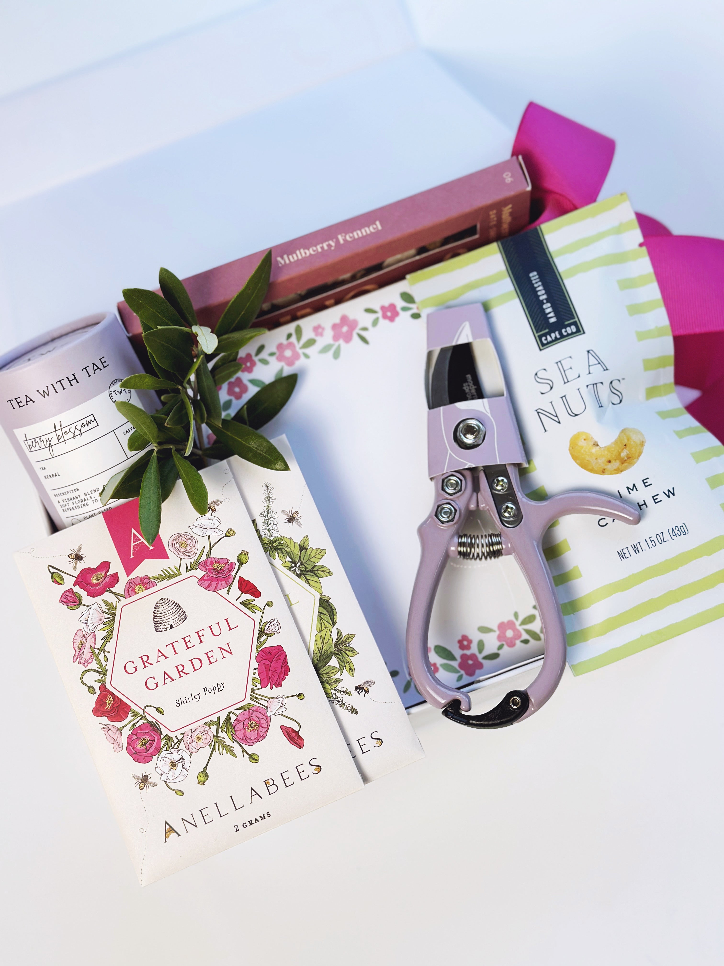 Poppins & Post Gardener's Gift Box with gardening tools, gloves, and plant seeds, perfect for gardening enthusiasts.
