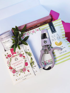 Poppins & Post Gardener's Gift Box with gardening tools, gloves, and plant seeds, perfect for gardening enthusiasts.